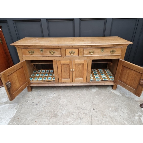 1072 - A 19th century oak dresser base, 180cm wide.