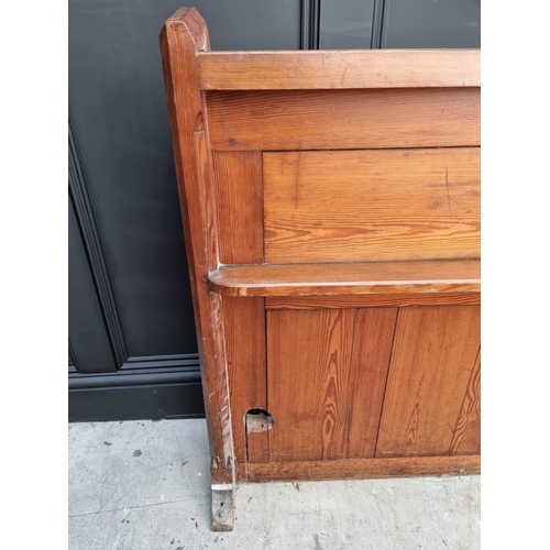 1074 - A Victorian pitch pine pew back, 162cm wide.