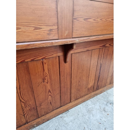 1074 - A Victorian pitch pine pew back, 162cm wide.