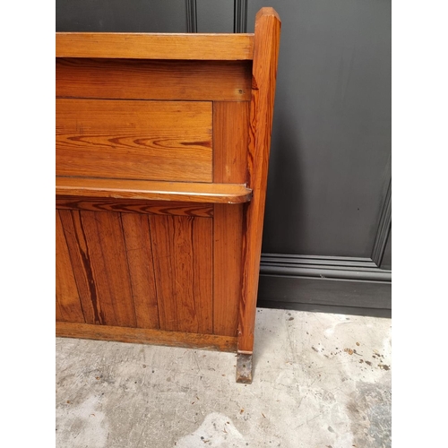 1074 - A Victorian pitch pine pew back, 162cm wide.