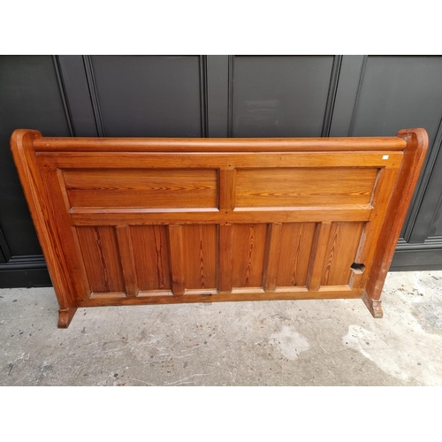 1074 - A Victorian pitch pine pew back, 162cm wide.