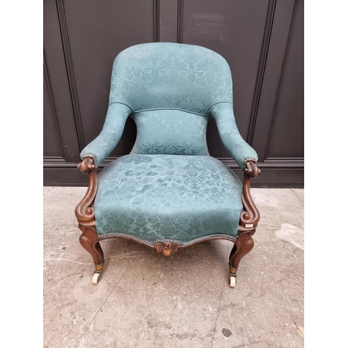 1078 - An early Victorian rosewood open arm occasional chair. 