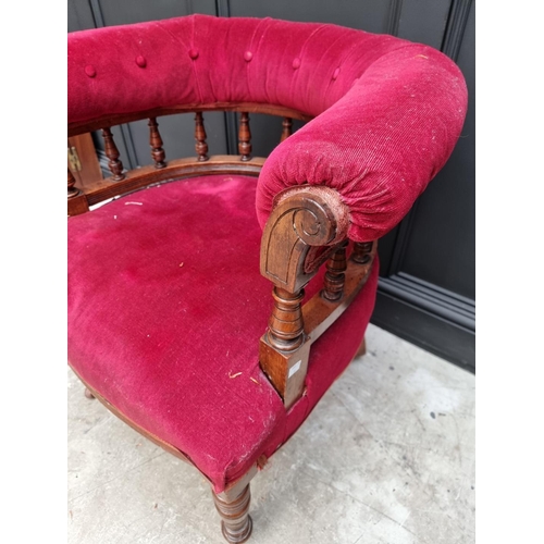 1080 - A late Victorian walnut and button upholstered desk chair.  