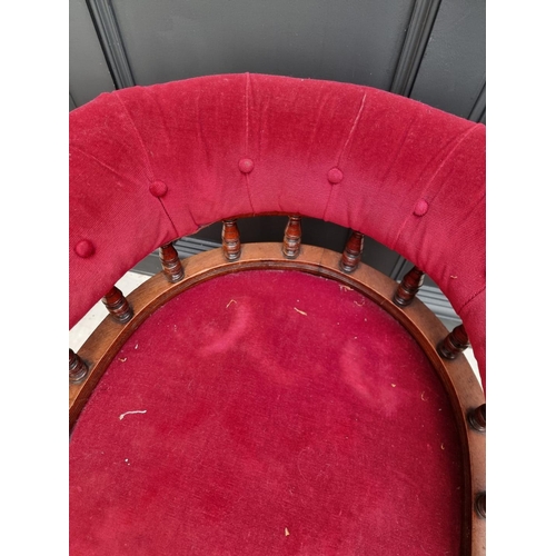 1080 - A late Victorian walnut and button upholstered desk chair.  