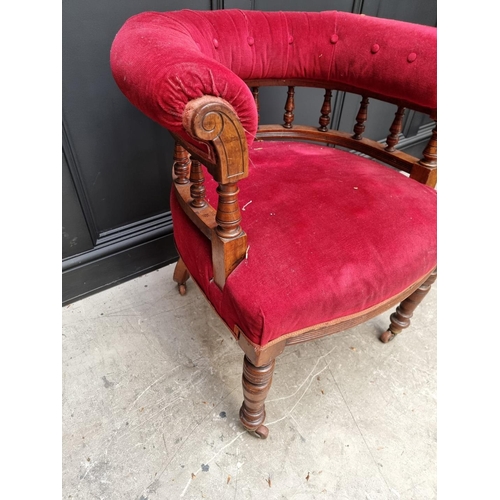 1080 - A late Victorian walnut and button upholstered desk chair.  