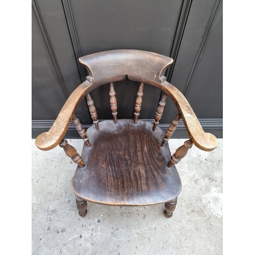 1085 - A 19th century ash, beech and elm smokers bow chair. 