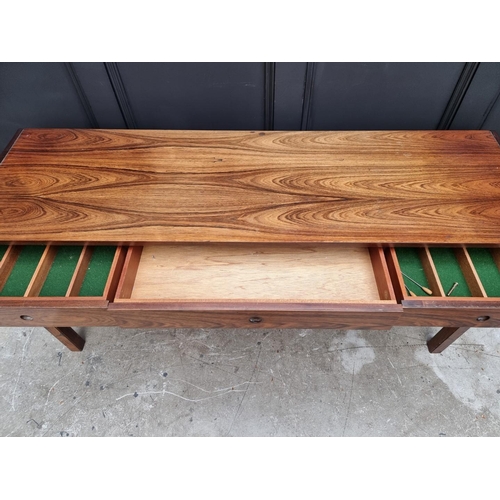 1089 - A mid-century rosewood side table, 152.5cm wide.