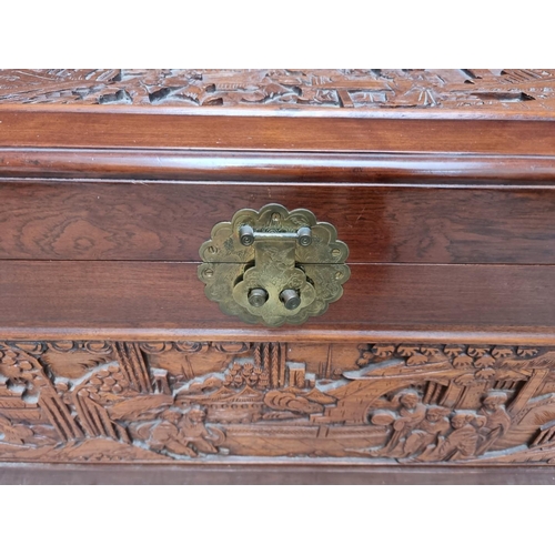 1095 - A Chinese carved camphor wood coffer, 100.5cm wide.