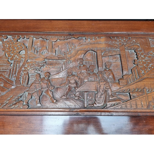 1095 - A Chinese carved camphor wood coffer, 100.5cm wide.