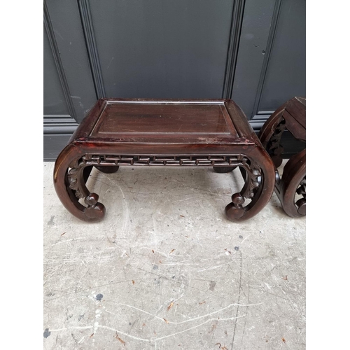 1096 - A pair of Chinese carved and stained wood opium tables, 64cm wide. 