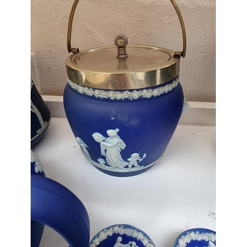 1127 - A collection of Victorian Wedgwood blue jasperware. (9)