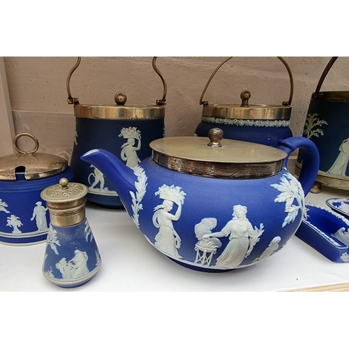 1127 - A collection of Victorian Wedgwood blue jasperware. (9)