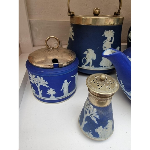 1127 - A collection of Victorian Wedgwood blue jasperware. (9)