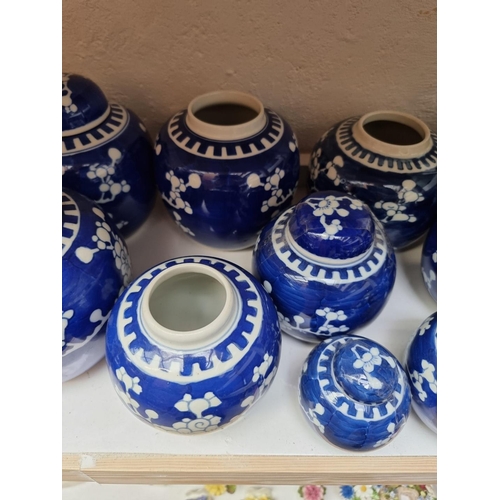 1129 - Fourteen Chinese blue and white ginger jars and eight covers, largest 14.5cm high.