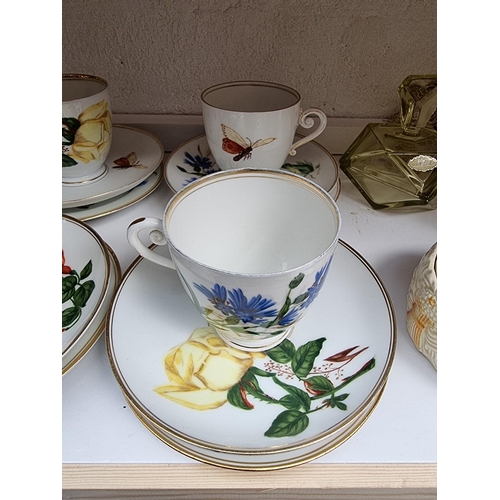 1143 - A set of six Berlin porcelain trios, each with printed decoration; together with an Echt Kristall gl... 