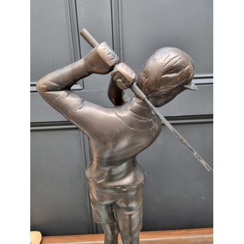 1154 - A large bronze figure of a lady golfer, 60cm high. 