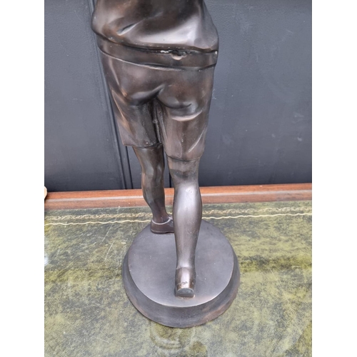 1154 - A large bronze figure of a lady golfer, 60cm high. 