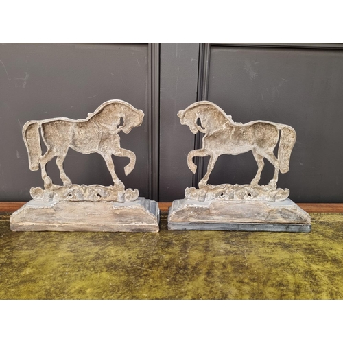 1168 - A pair of aluminium horse doorstops, 27.5cm high.