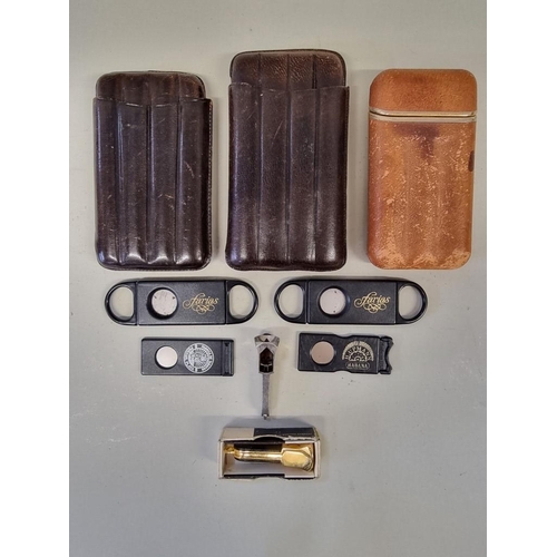 220 - Three leather cigar cases; together with six cigar cutters. (9)