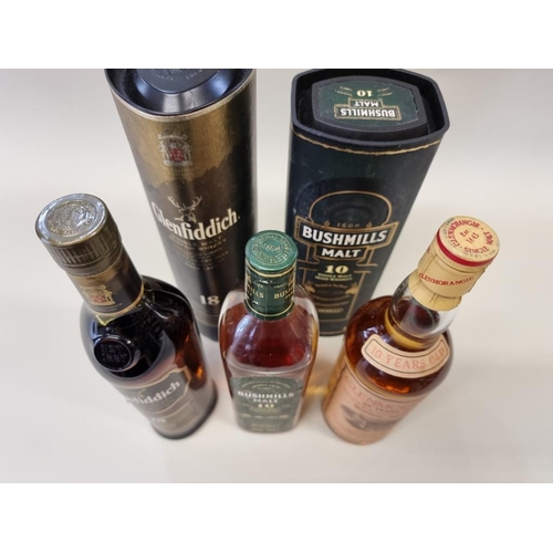 47 - Three bottles of whisky, comprising: Glenfiddich 18 year old, in card tube; a Bushmills 10 year old,... 