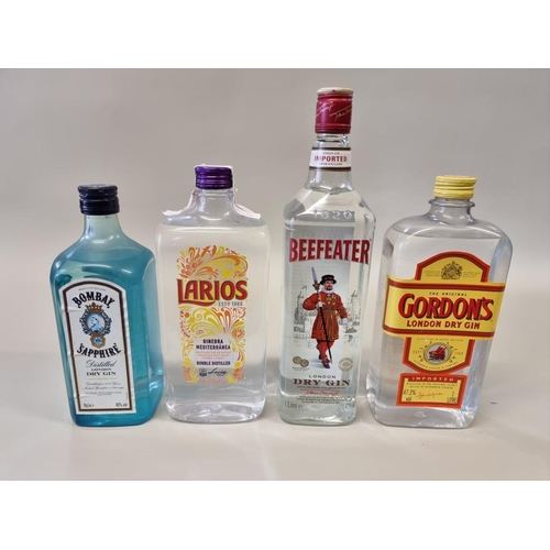 71 - Four bottles of gin, comprising: a 1 litre Beefeater; a 1 litre Gordon's; a 1 litre Larios; and a 70... 