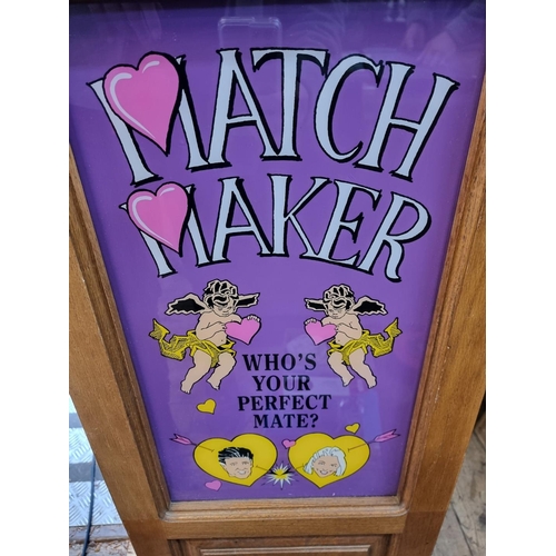 1046 - An oak cased 'Match Maker' arcade machine, on gilt cast metal legs, 187cm high x 47cm wide at feet.... 