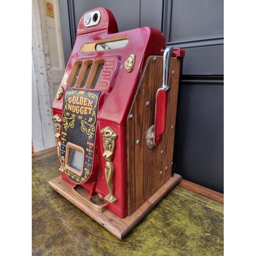 A vintage Bell's 'Golden Nugget' one arm bandit arcade machine