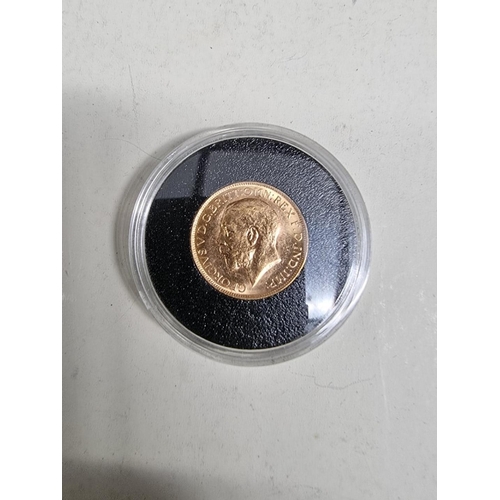 303 - Coins: a George V 1916 gold sovereign, Perth mint.