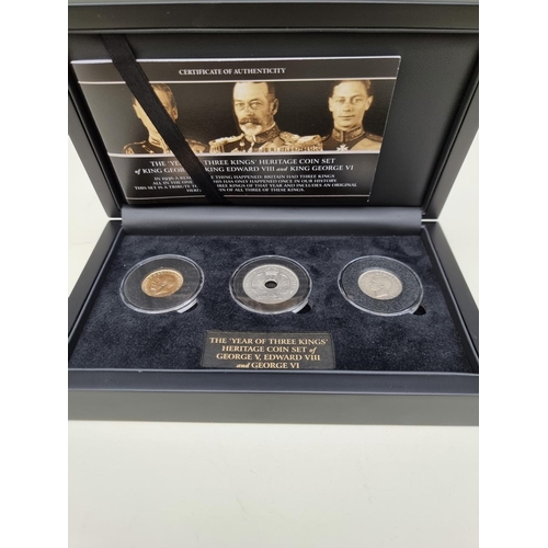 357 - Coins: a 'The Year of Three Kings Heritage Coin Set' comprising: a 1925 George V 1925 gold sovereign... 