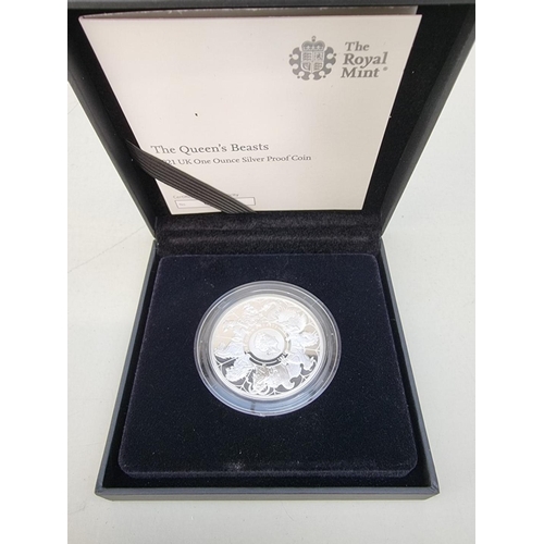 390 - Coins: a 2021 Royal Mint 'The Queen's Beasts' 1oz silver proof two pound coin, with CoA No.601, book... 