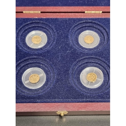 438 - Medals: a set of four 'Year of the Three Kings' .585 gold medals, 0.5g each, boxed. (4)... 