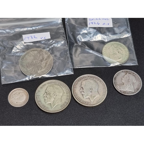 446 - Coins: a Victoria 1898 silver shilling and five George V silver coins. (6)