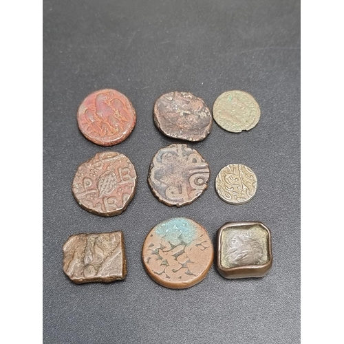 450 - Coins: seven Persian hammered coins.