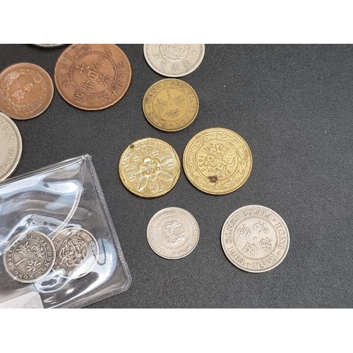 458 - Coins: Hong Kong, fourteen silver and other coins.