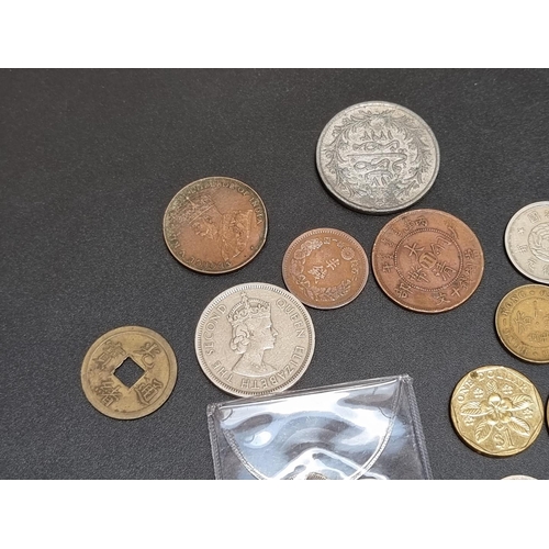 458 - Coins: Hong Kong, fourteen silver and other coins.