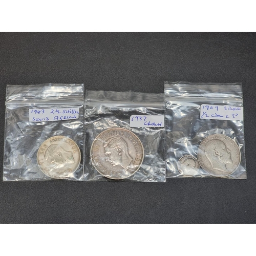 459 - Coins: a George VI 1937 silver crown; together with a Edward VII 1909 silver half crown; and threepe... 