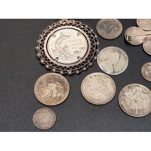 460 - Coins: a small quantity of foreign white metal coinage; to include a French 1965 10 francs.... 