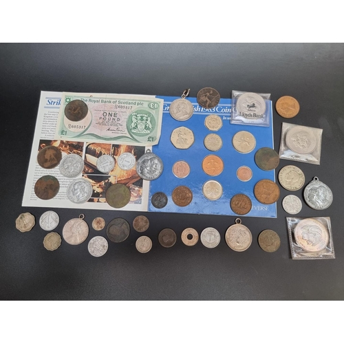 479 - Coins: a small quantity of UK and world coins; together with a Royal Bank of Scotland one pound note... 