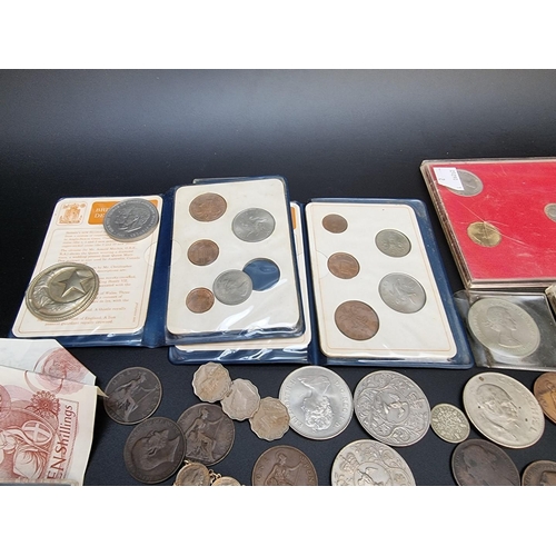 490 - Coins: a small collection of UK coins and bank notes; to include a few silver examples.... 