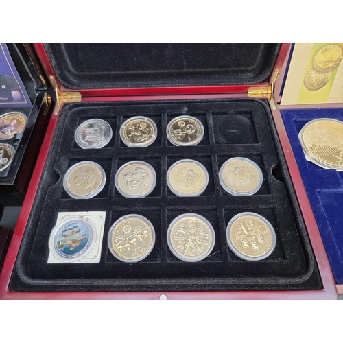 499 - Coins: a quantity of boxed commemorative medals, coins and similar.