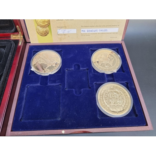 499 - Coins: a quantity of boxed commemorative medals, coins and similar.