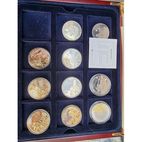 499 - Coins: a quantity of boxed commemorative medals, coins and similar.