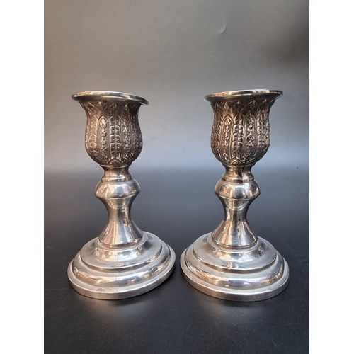 508 - A pair of Thai white metal candlesticks, stamped 'Thailand Sterling', 11cm high.