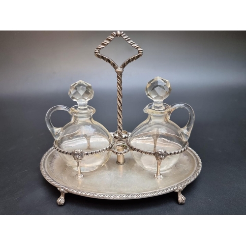 518 - A 19th century continental white metal two bottle cruet stand, stamped 800, 22cm wide.... 