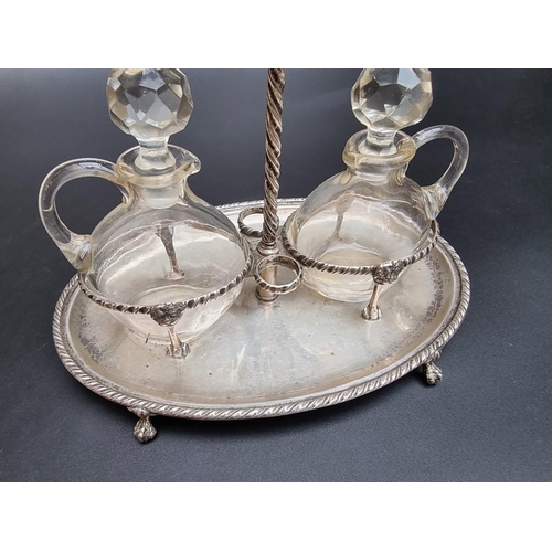 518 - A 19th century continental white metal two bottle cruet stand, stamped 800, 22cm wide.... 