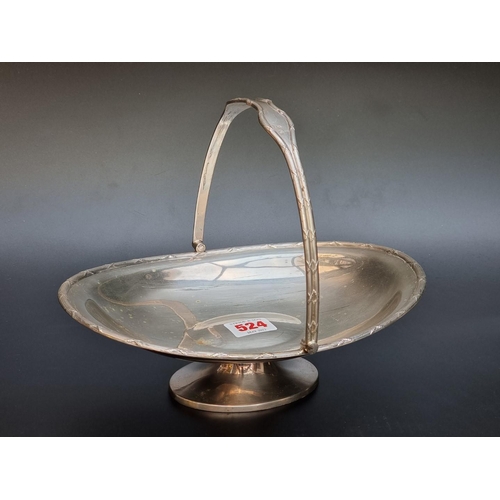 524 - A silver swing handled pedestal basket, by James Deakin & Sons, Sheffield 1932, 25cm long, 479g.... 