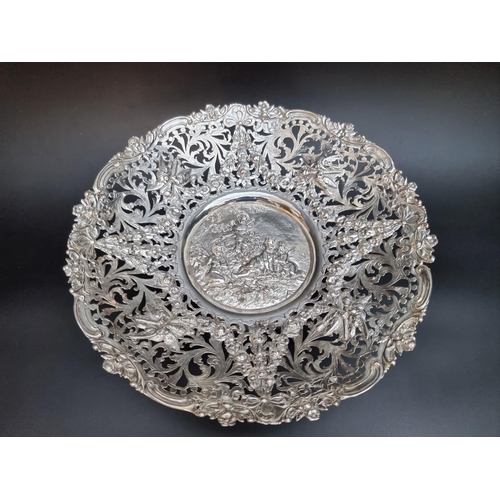 533 - An impressive 19th century continental pierced white metal fruit bowl, 32cm diameter.... 