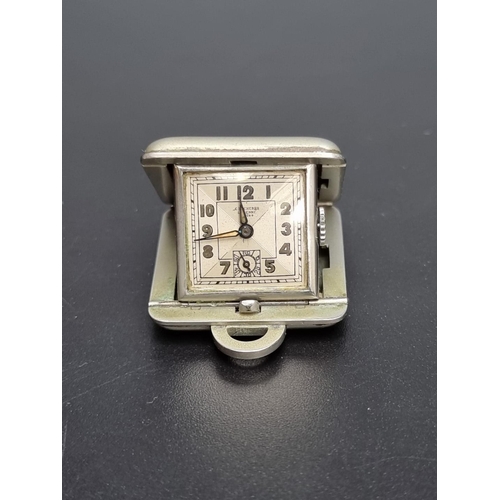 841 - An Art Deco Bucherer nickel-plated manual wind folding traveling watch, 30mm.