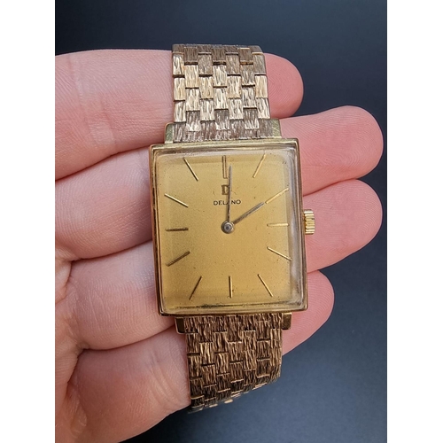 850 - A vintage Delano yellow metal manual wind wristwatch, the rectangular case 30 x 26mm, stamped 750 an... 