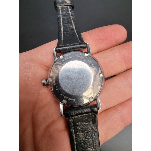 859 - A vintage Chalet stainless steel automatic wristwatch, 34mm, on a black leather strap; together with... 